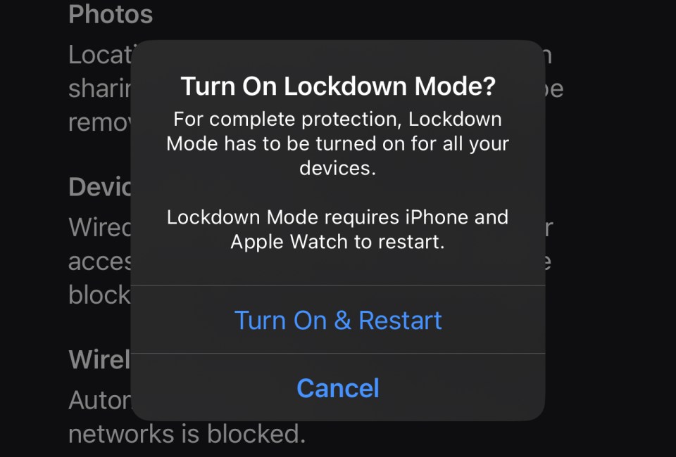 iPhone Lockdown Mode prompt: requires restart of iPhone and Apple Watch for complete protection.