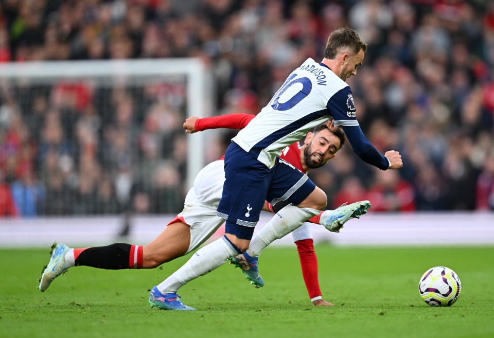 James Maddison of Tottenham Hotspur being fouled during a Premier League match.