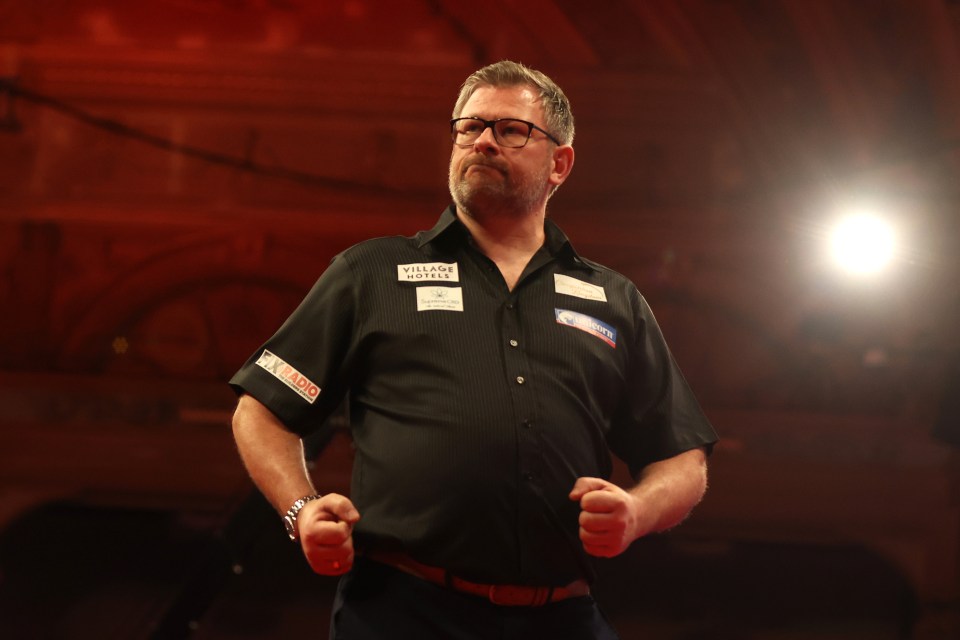 James Wade celebrates a darts victory.