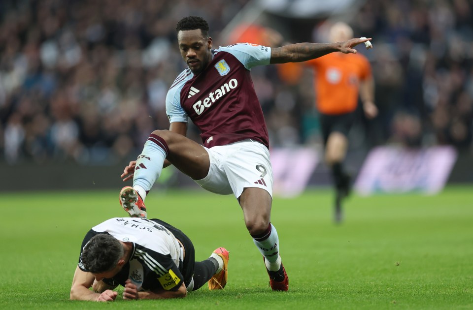 Jhon Duran of Aston Villa fouls a Newcastle United player, resulting in a red card.