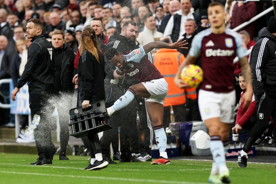 Aston Villa's Jhon Duran kicks a water bottle after receiving a red card.