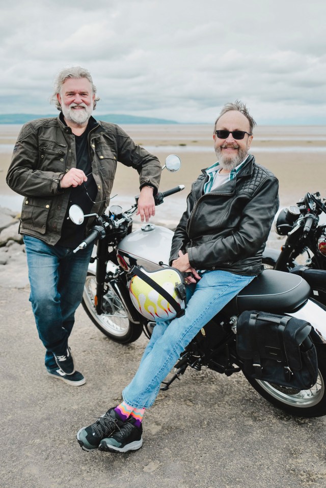 Dave Myers and Si King, from The Hairy Bikers, posing with motorcycles.