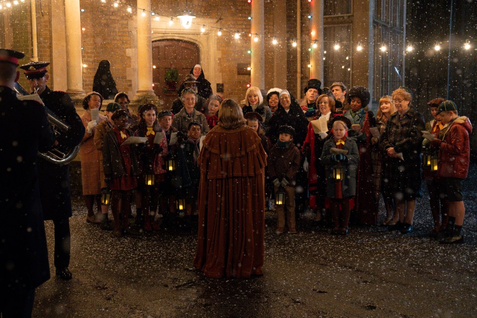 Call the Midwife cast and children carolers in the snow.