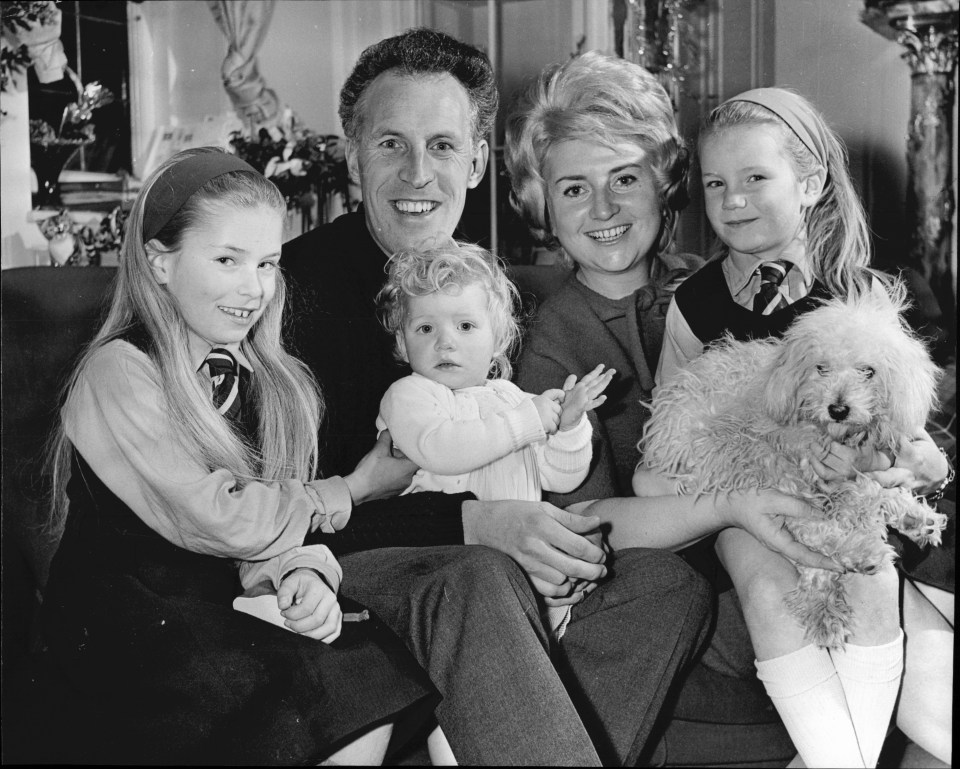 A snap of Laura as a baby (centre) with her dad Bruce and mum Penny