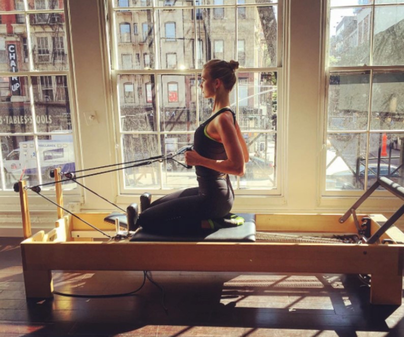 Karlie Kloss looking strong at a Pilates studio