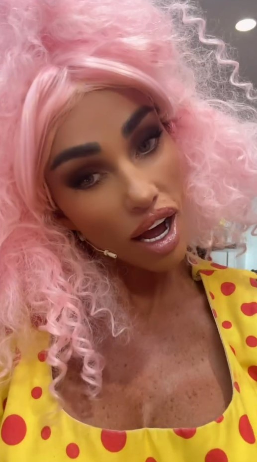 Katie Price wearing a pink wig and yellow polka dot dress.