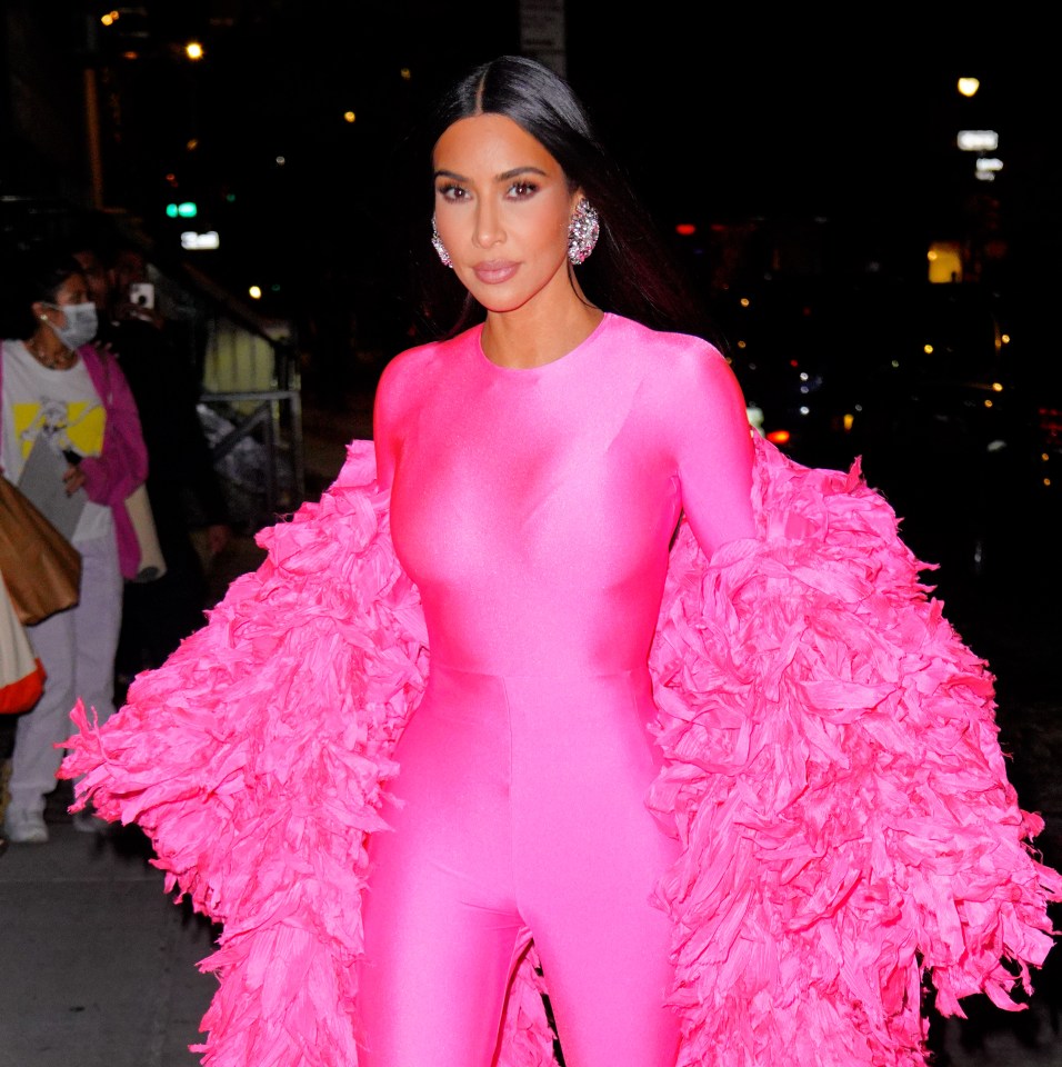 Kim channels Cher in a pink bodysuit and ruffled jacket in 2021