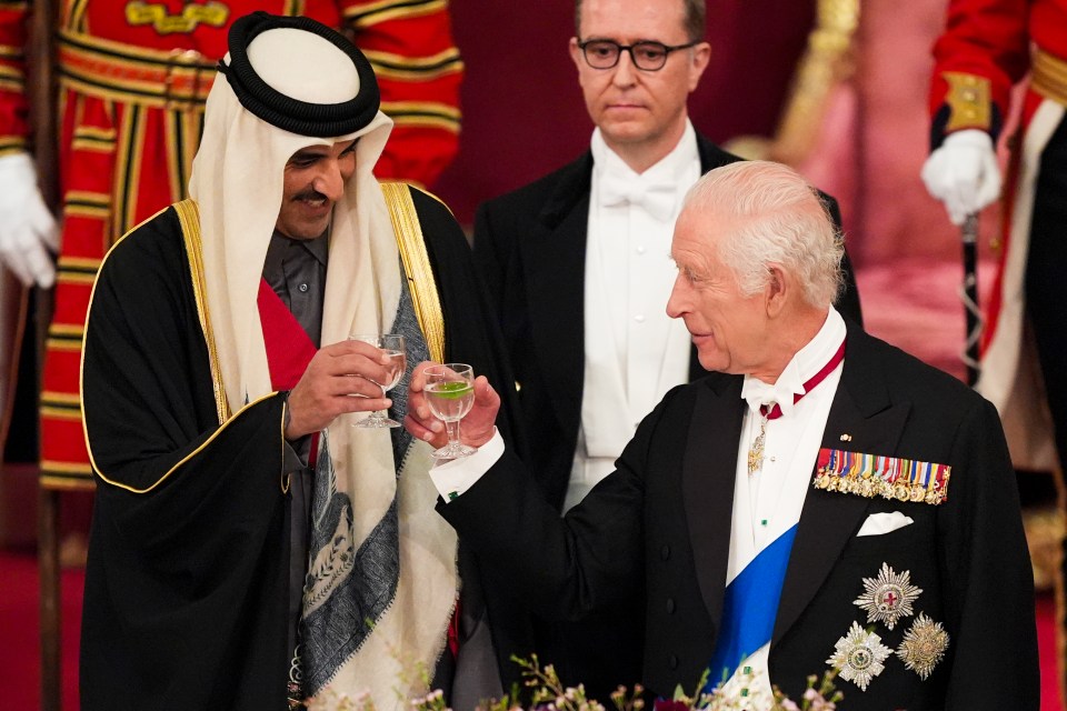 Charles and the Emir share a toast