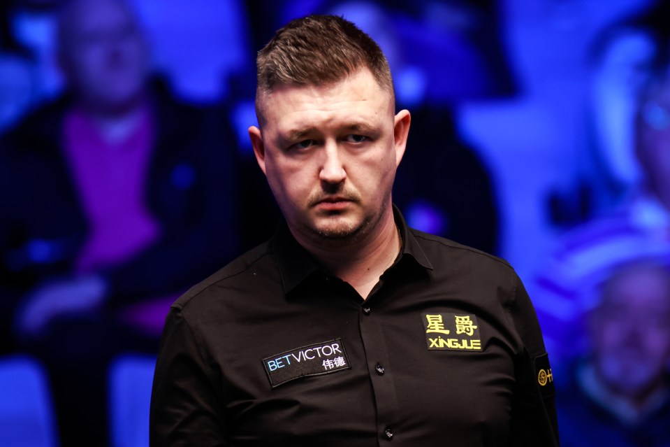 Kyren Wilson of England reacts during a snooker match.