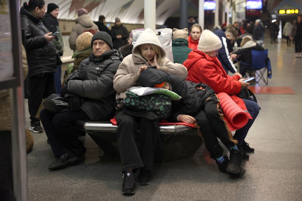 Kyiv residents sheltering in a metro station during an air raid.