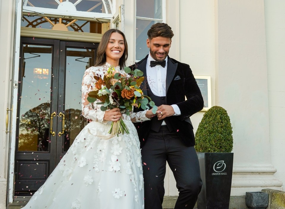 A bride and groom leaving a wedding ceremony, confetti falling around them.