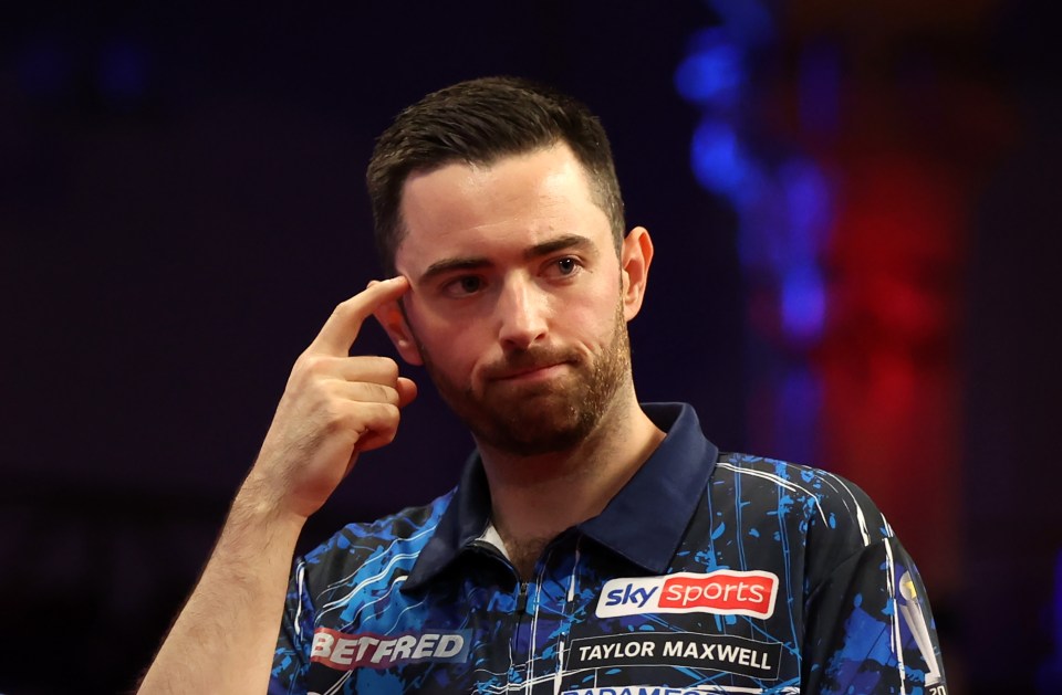 Luke Humphries of England celebrates his win against Dimitri Van den Bergh of Belgium during the 2024 Betfred World Matchplay quarter-final match.