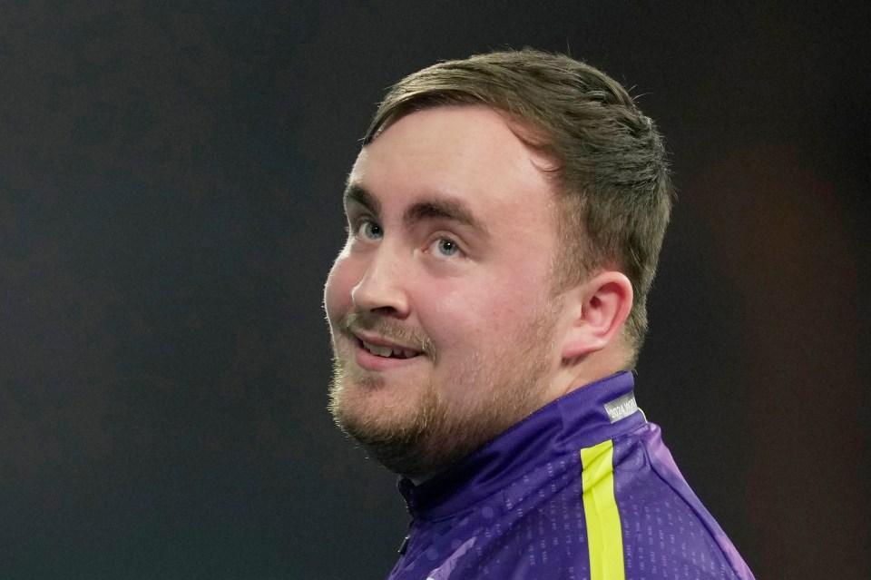 Luke Littler of England reacts during a World Darts Championship semifinal match.