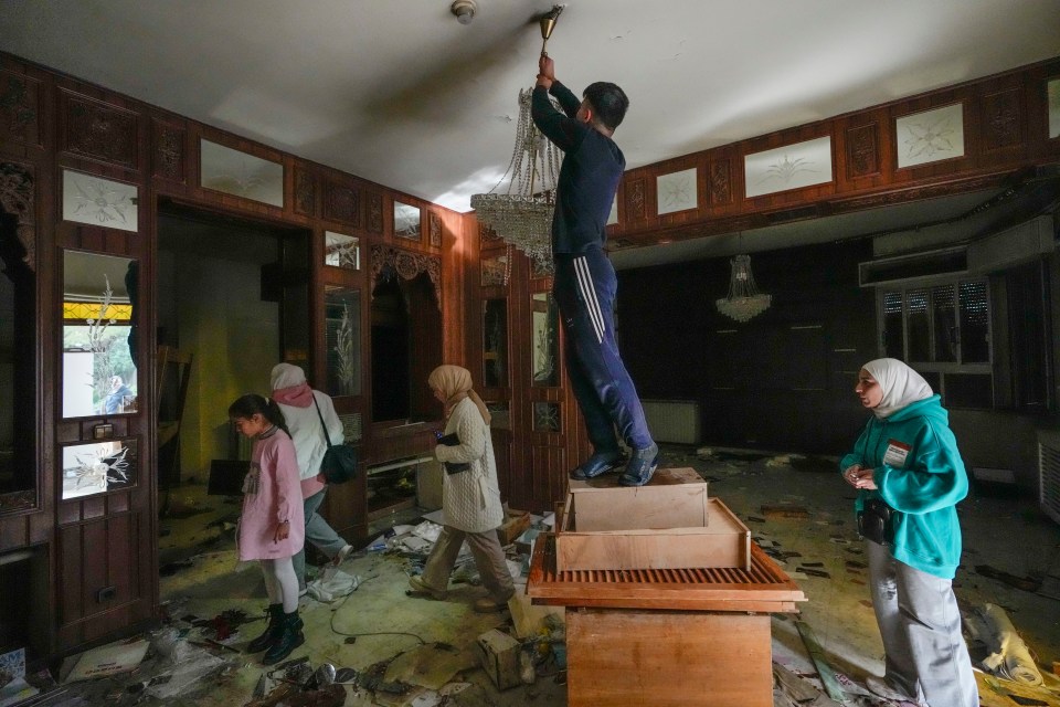 Looters ransacked Assad's palace going from room to room and searching all over for any prized possessions