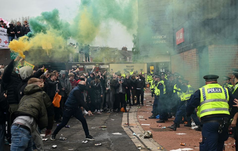 A group of restless Manchester United fans outside Old Trafford