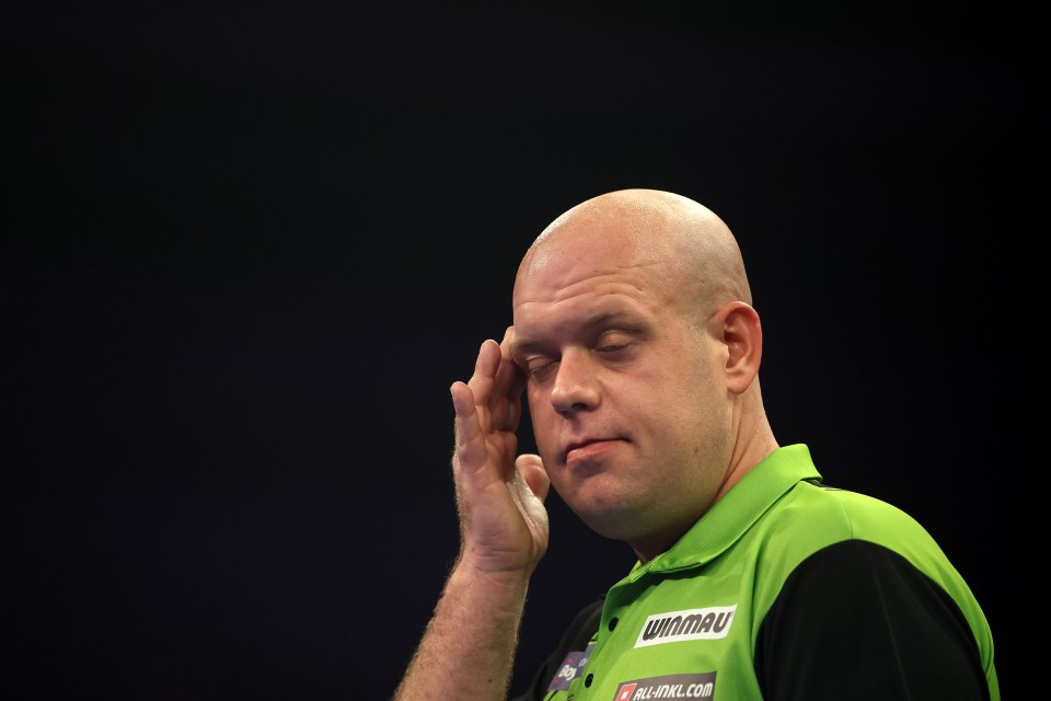 Michael van Gerwen reacting during a darts match.