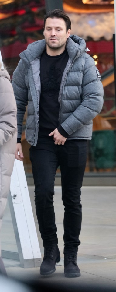 Husband Mark wore black and a puffer coat for the meet up with BFF James Argent and his girlfriend