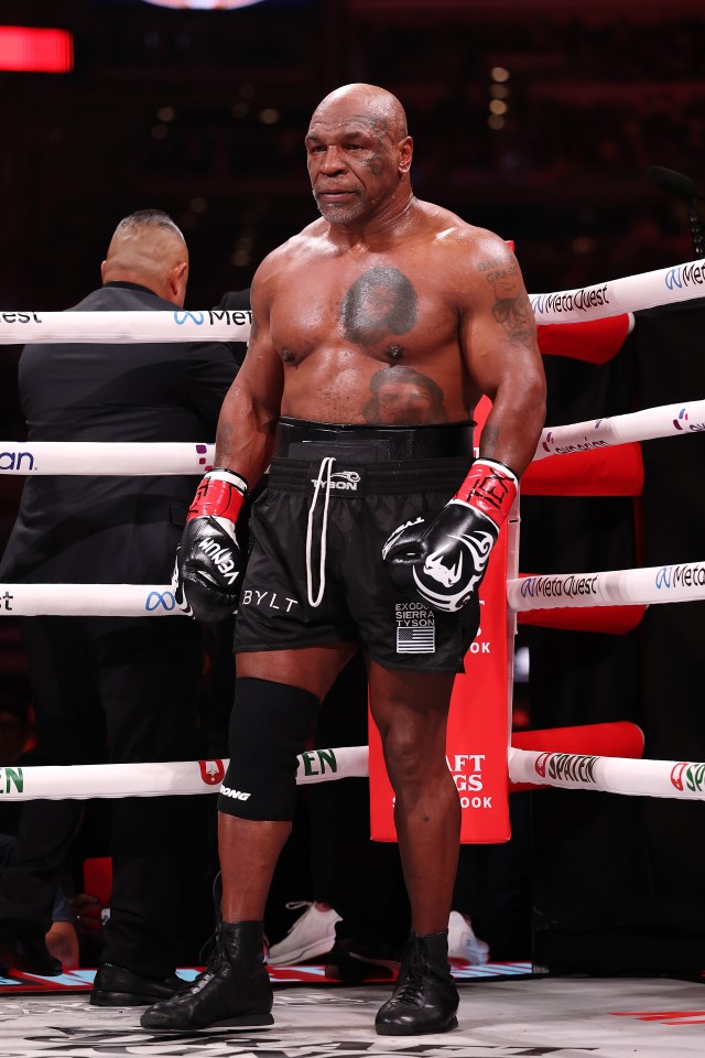 Mike Tyson in boxing ring.