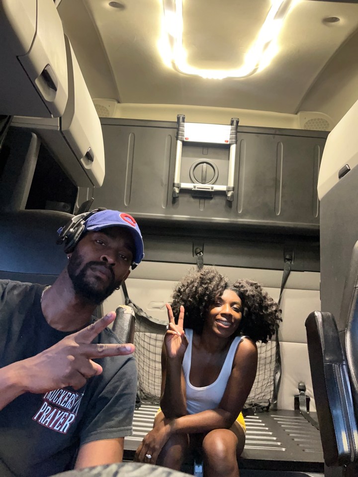 Mila Horton, 28, with husband Jermaine, 30, in their sleeper truck. they travel the US in