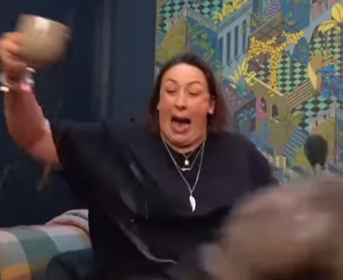 Miranda Hart screaming in horror while holding a cup.