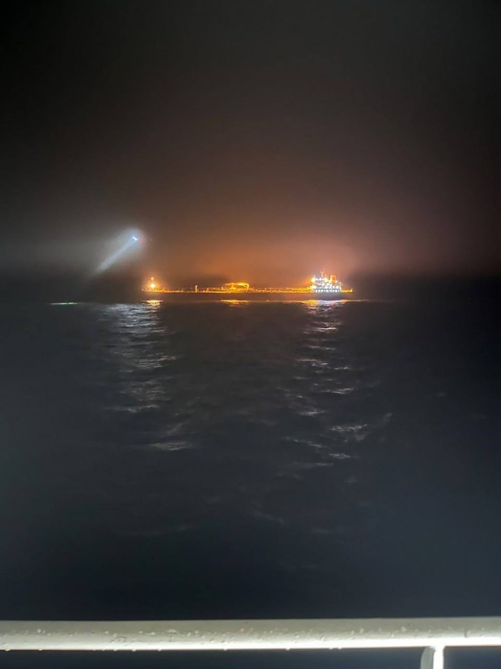 Finnish police seizing a Russian-linked tanker at night.