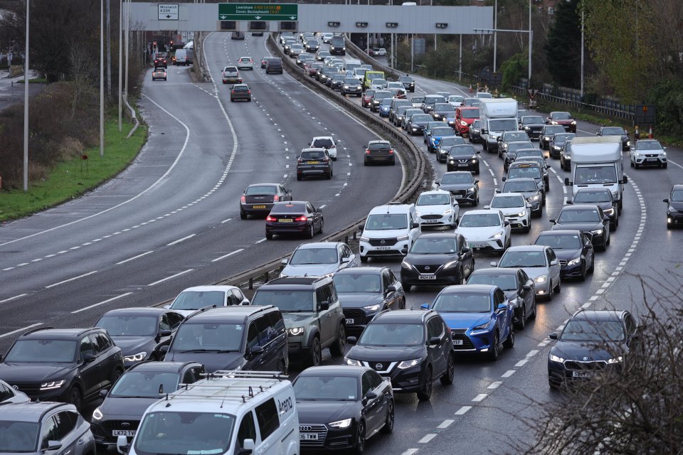 Traffic queues on the A102M Blackwall Tunnel approach in Greenwich South East London as the Christmas getaway begins