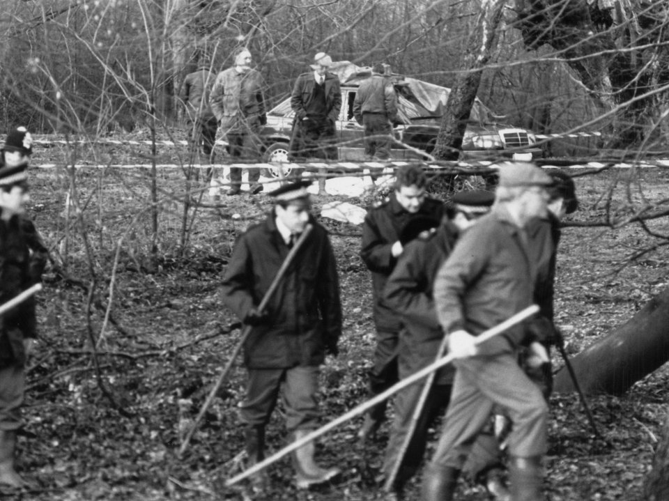 Cops combing the patch of the forest where the couple were discovered