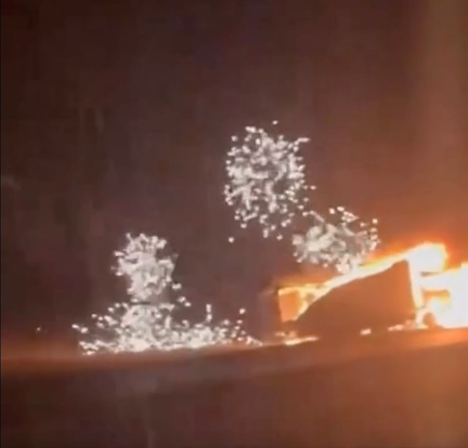 Footage caught a barrage of rockets flying into the sky after the Mercedes-Benz lorry overturned