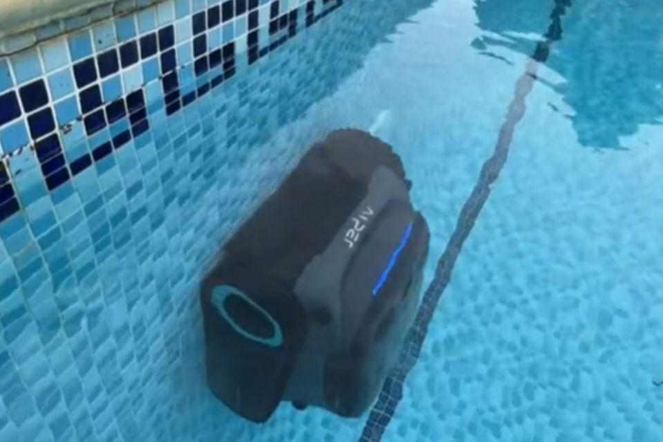 Miles uses a robot which can drive up swimming pall walls