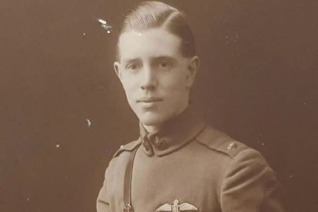 Sepia-toned portrait of a young man in military uniform.