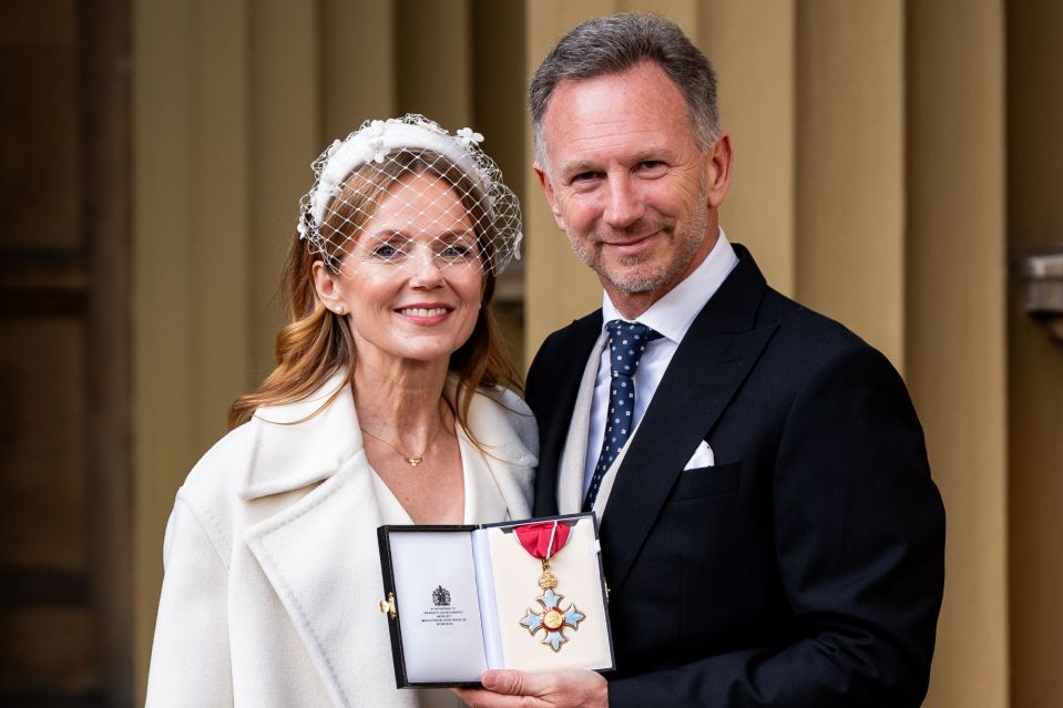 Couple holding a medal at an investiture ceremony.