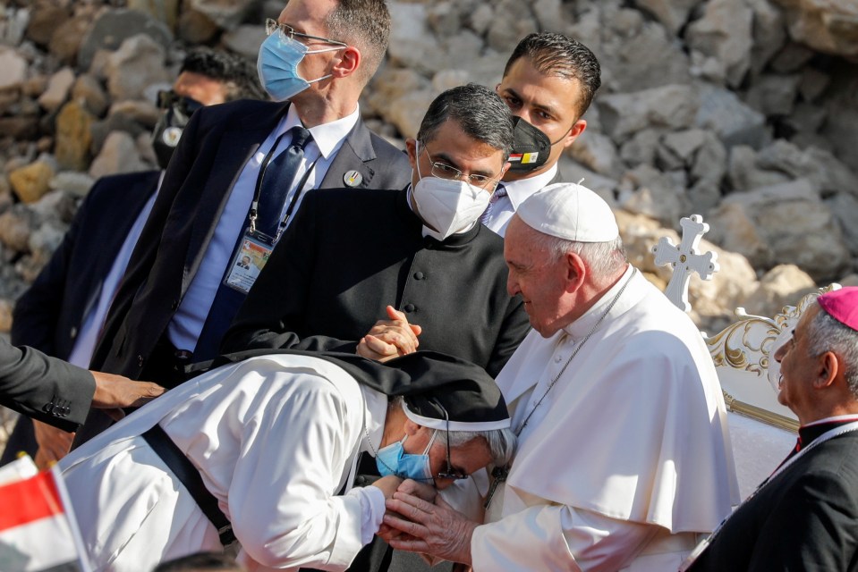 A woman wearing a suicide vest and a truck loaded with explosives were intercepted en route to Mosul, both aiming to target the papal visit, above