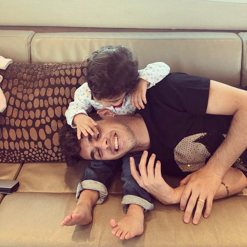 Brazil footballer Oscar plays with son Caio