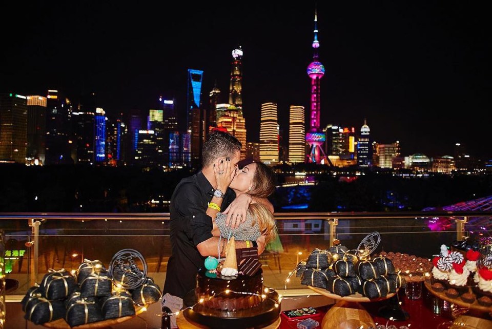 The loved-up couple share an intimate moment at the five-star Peninsula Shanghai