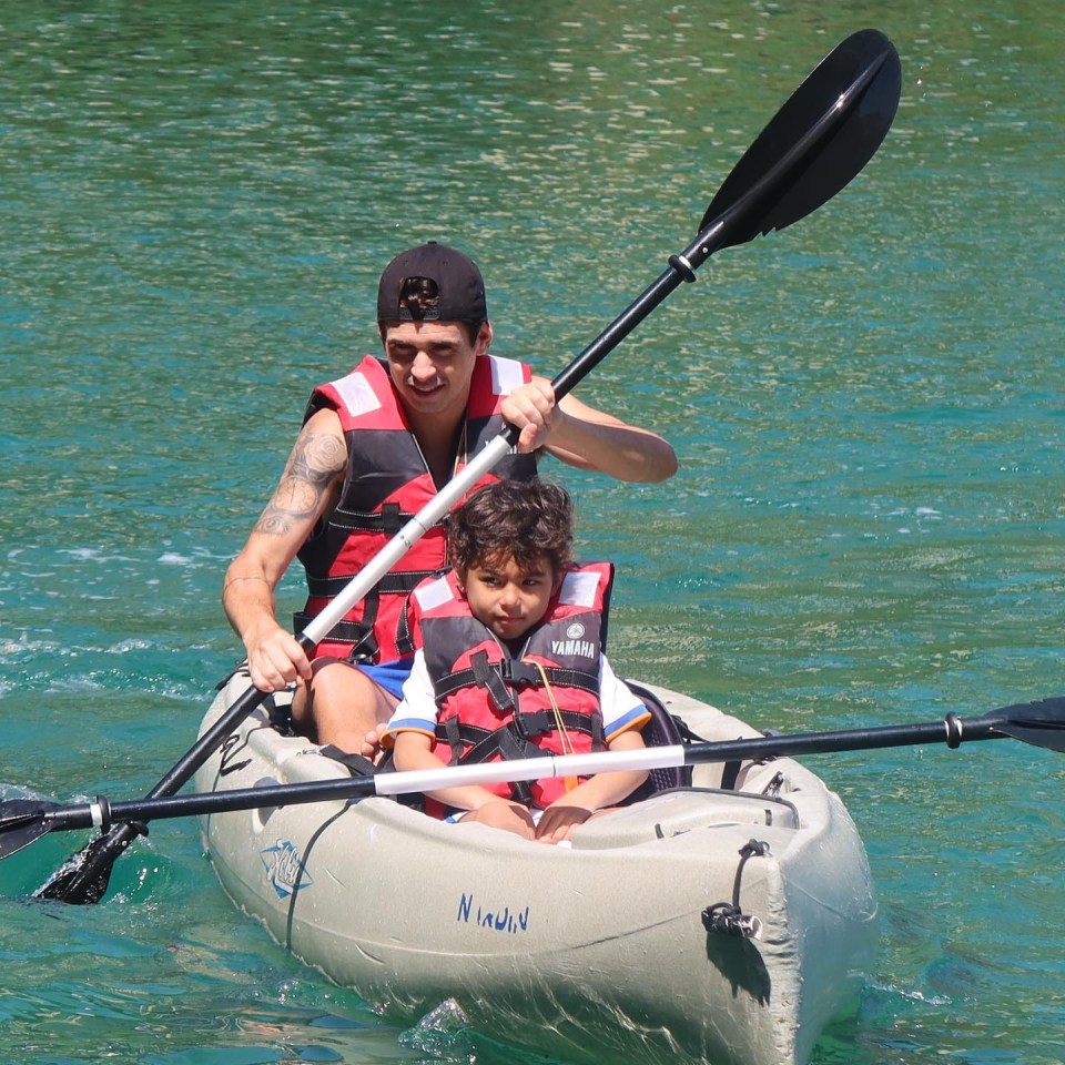 Oscar's son Caio enjoys a spot of canoeing with his dad