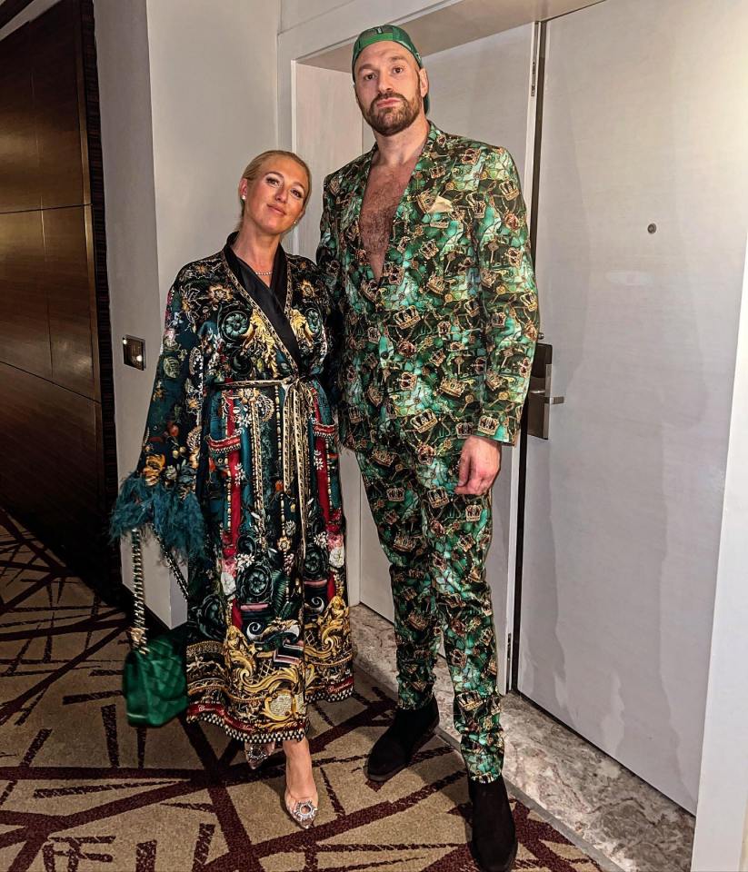 Paris and Tyson Fury matching in green, crown-patterned outfits.