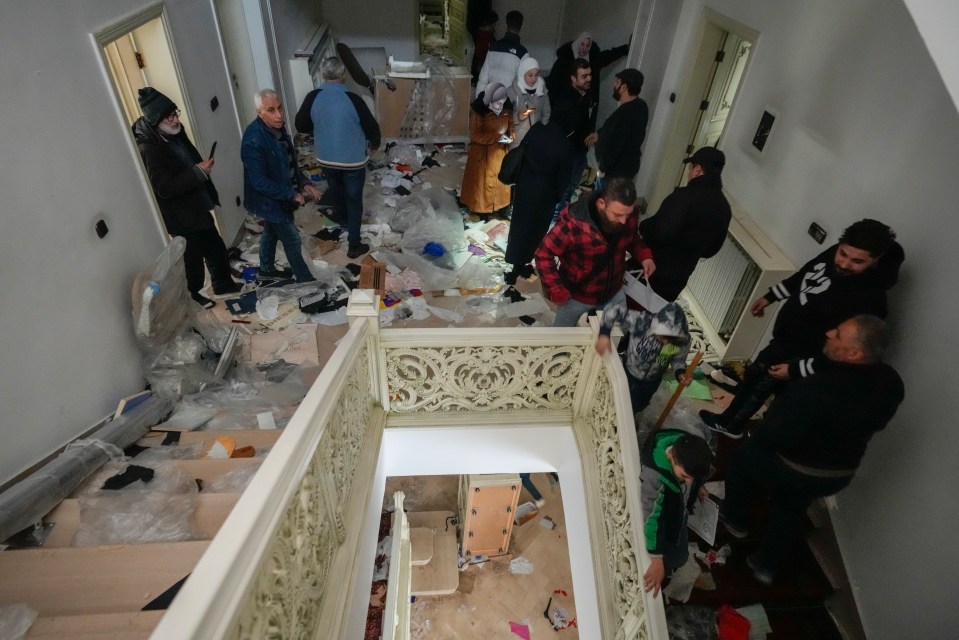 People search for belongings in Bashar al-Assad's ransacked presidential palace