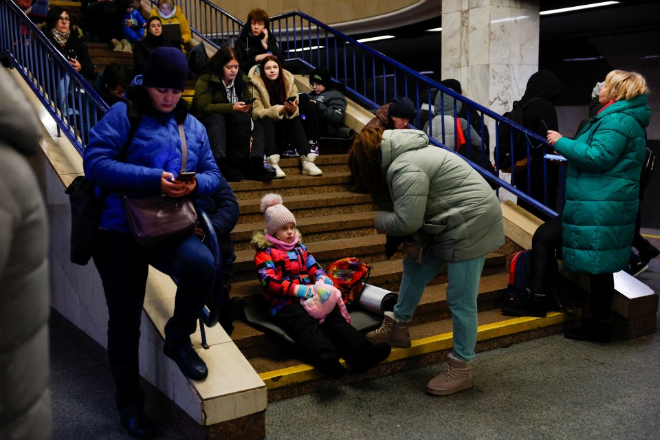 People sheltering in a Kyiv metro station during a military strike.