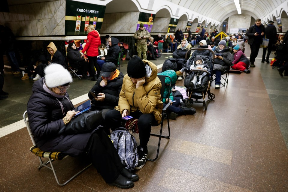 People take shelter at a Kyiv metro station during an air raid alert, amid Russia’s Christmas attack on Ukraine