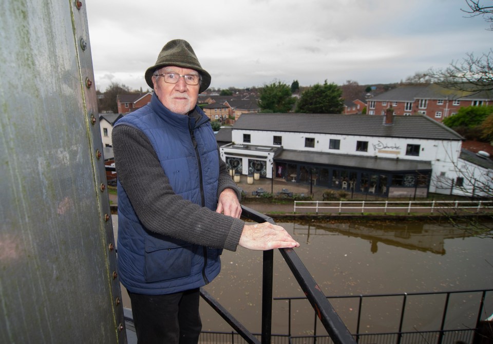 Phil Austin atop his Manchester lighthouse.