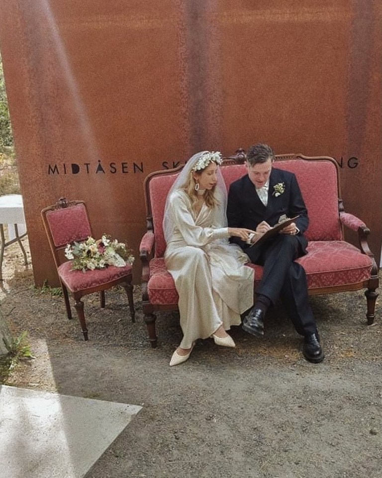 Bride and groom reviewing wedding documents.