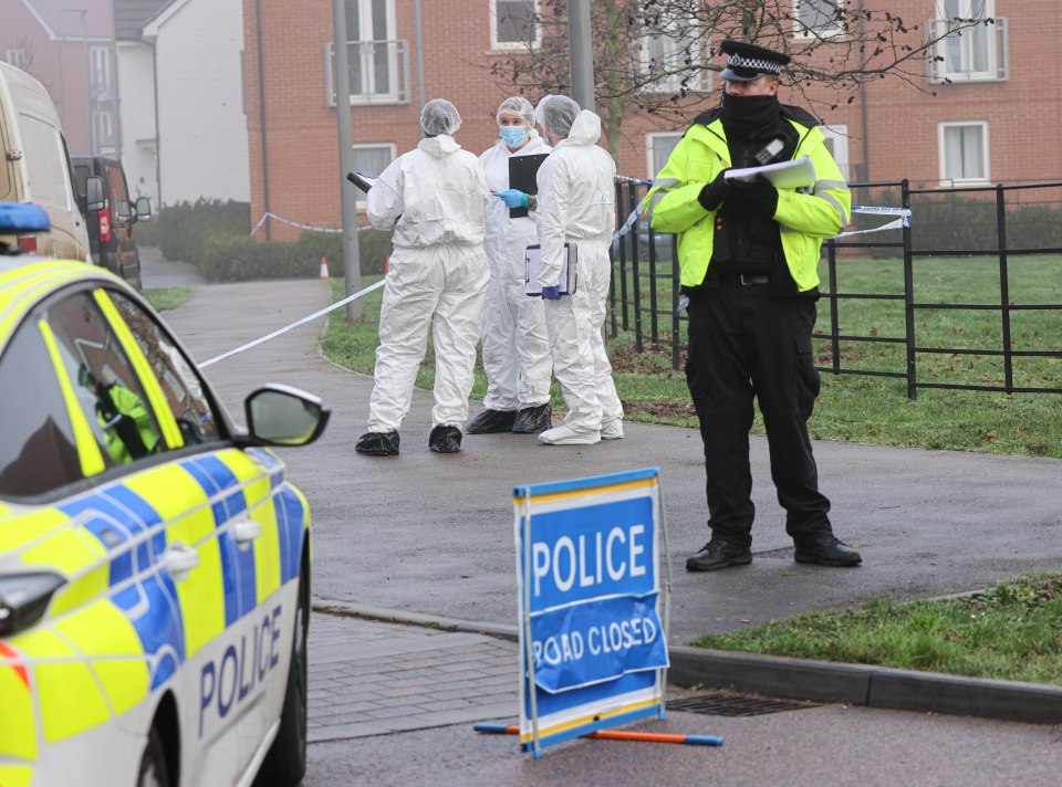 Police and forensic officers inside the cordon on Boxing Day