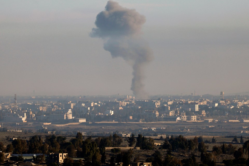 Smoke billowing above the Syrian Governorate of Quneitra during Israeli bombardment after strikes on weapons depots in Syria’s east on December 8