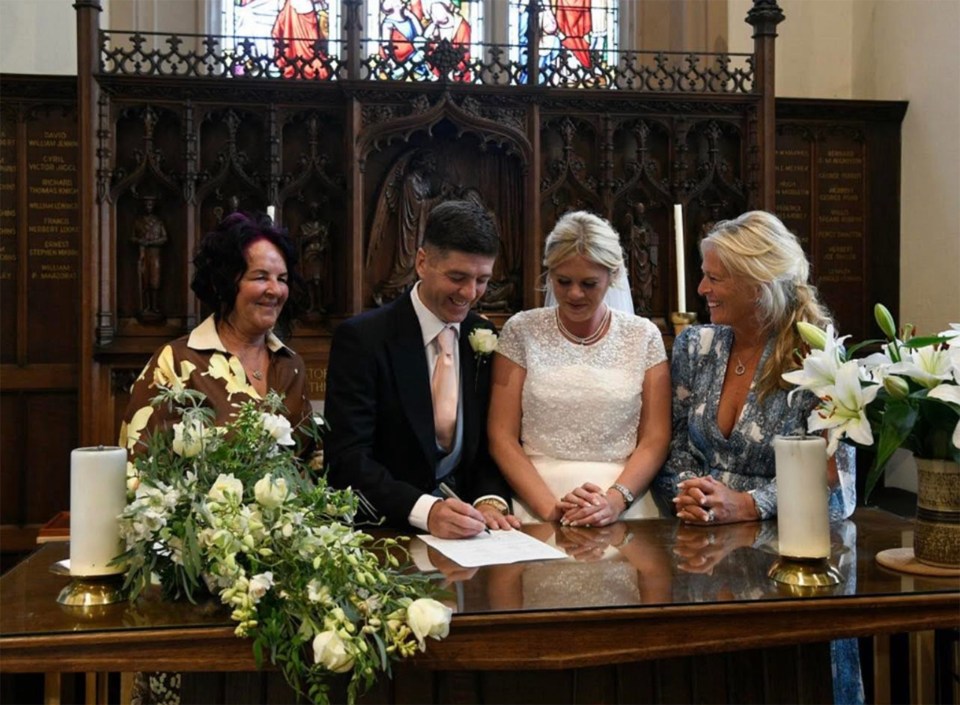 John Paul Brennan and Lara Faber-Johnson (centre) on their wedding day