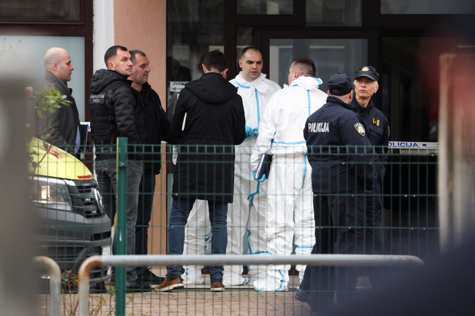 Police officers at a primary school following a knife attack.