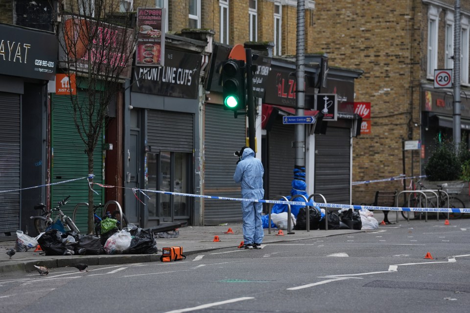 Forensics teams at the scene in Acton, west London