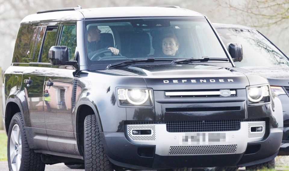 Prince Andrew and Sarah Ferguson in a Land Rover.