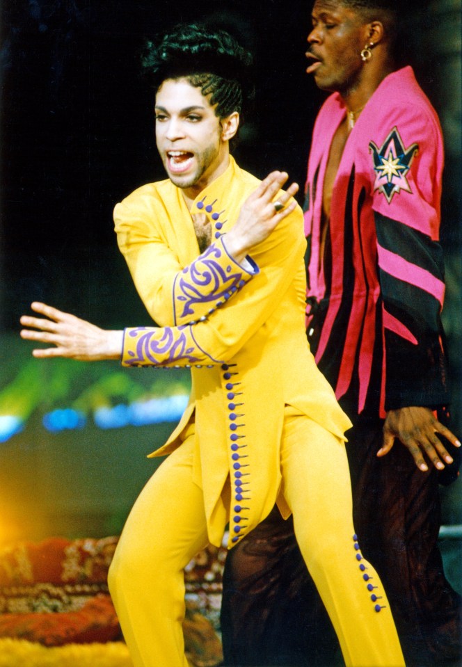 Prince performing in concert.