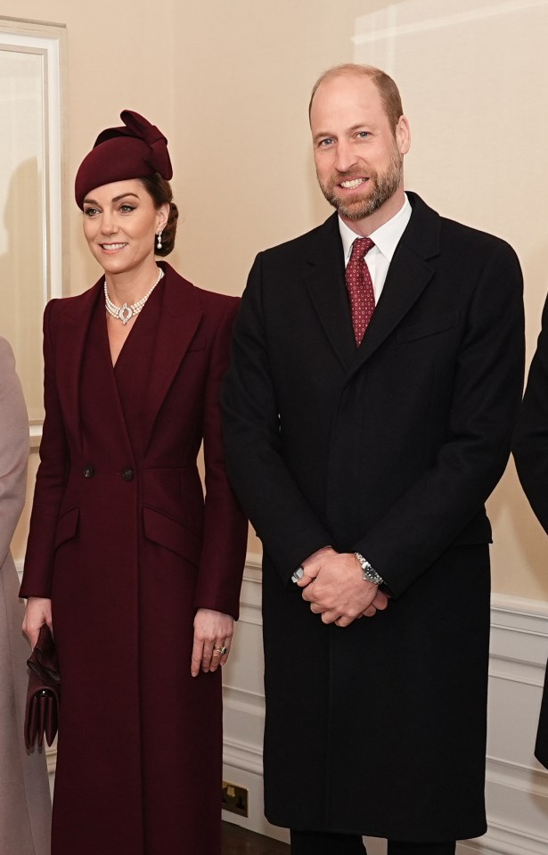 Kate stunned in a burgundy coat and matching boots