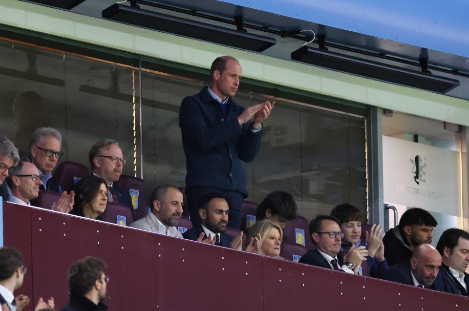 Prince William applauding at a soccer match.